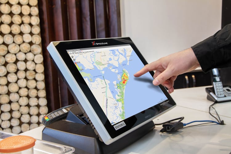 Person using a touchscreen POS display with a heat map on it.