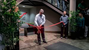 President & CEO John deWolde of SpeedLine Solutions Inc cutting the ribbon at their new Abbotsford office