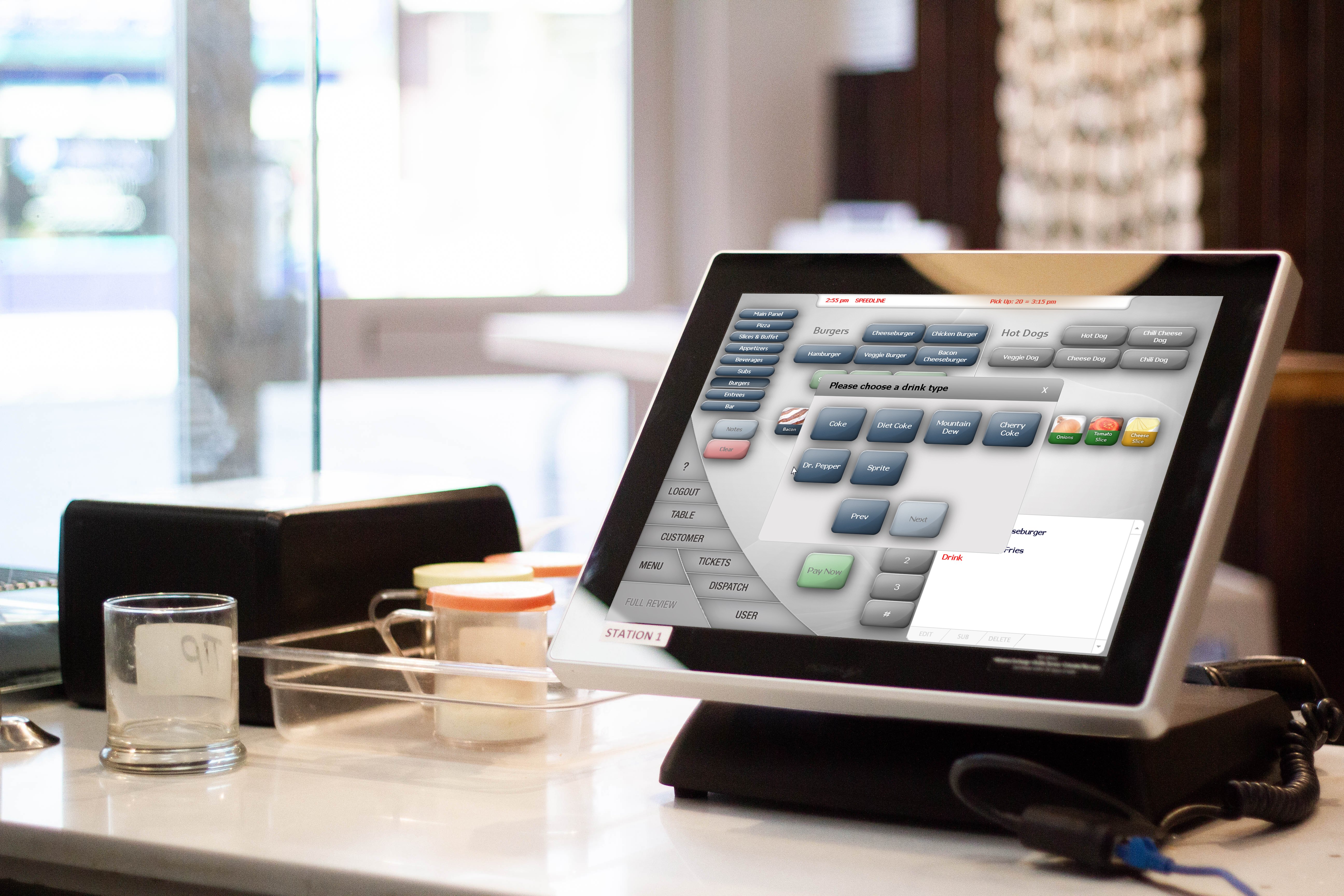 The SpeedLine order entry screen on a POS on a pizzeria countertop