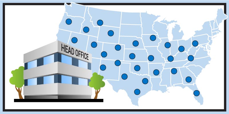 A restaurant head office building in front of a map showing all their locations in the United States