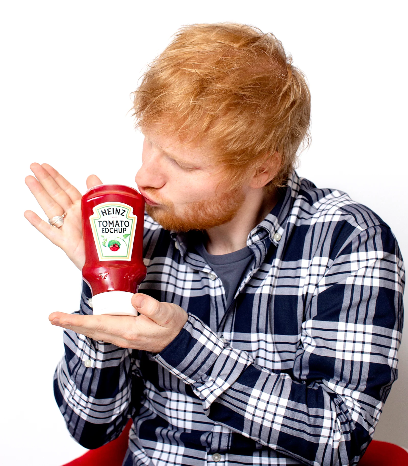Ed Sheeran kissing a custom ketchup bottle