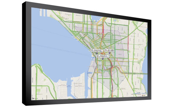 A monitor showing delivery zones for the restaurant, and pins showing the delivery order addresses